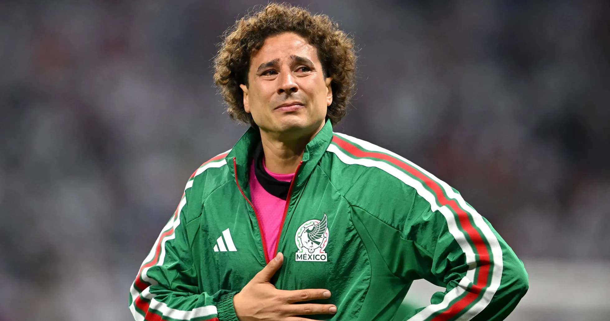 Goalkeeper wearing Mexico jacket on field