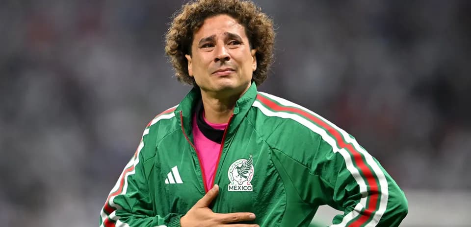 Goalkeeper wearing Mexico jacket on field