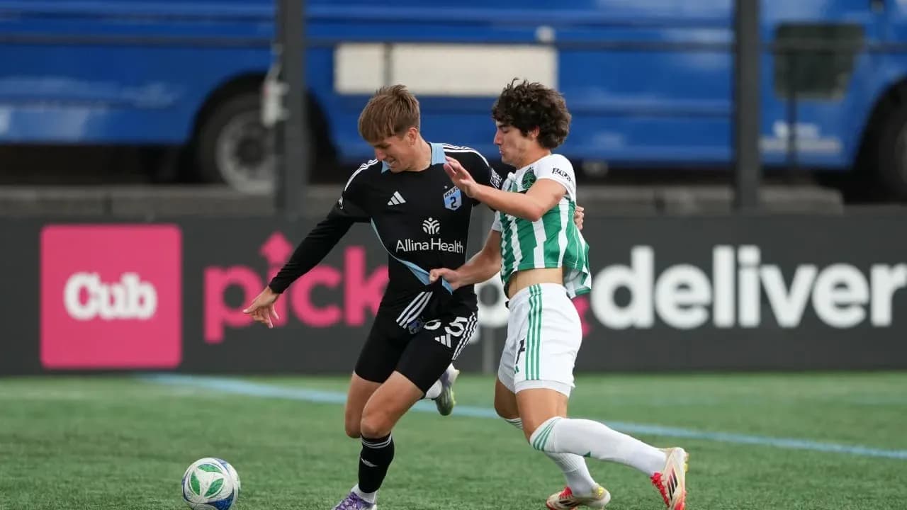 Players competing for the ball in MLS Next Pro