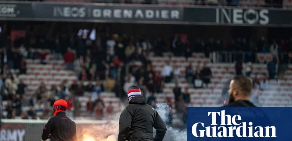 Fans igniting flares during a match in stadium