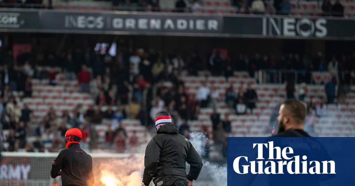 Fans igniting flares during a match in stadium