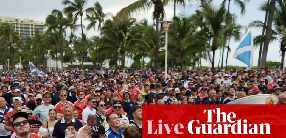 Large crowd of fans at outdoor event with palm trees