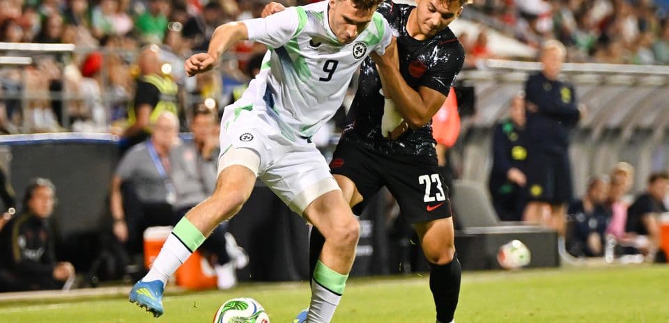Two players contesting for the ball during match