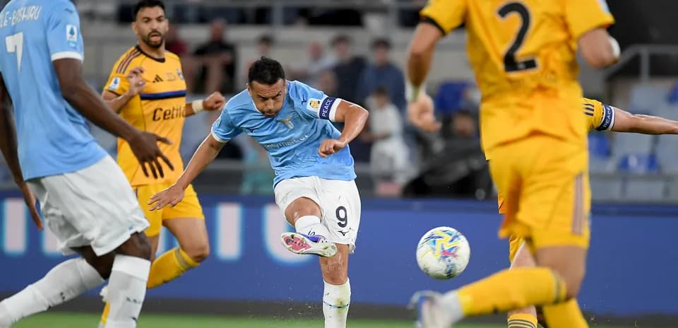 Lazio player shooting at goal during match