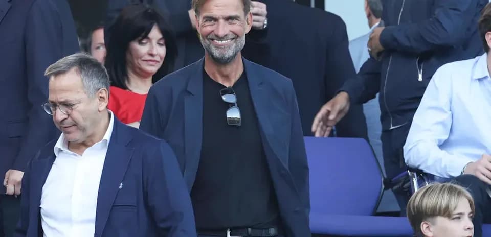 Two men and a boy in a stadium setting