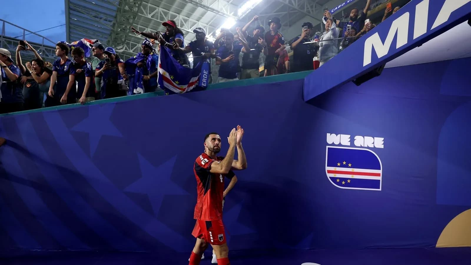 Player applauding fans after the match in stadium