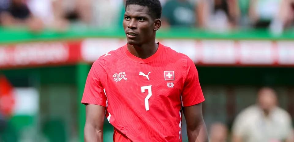 Player wearing red Swiss jersey on field