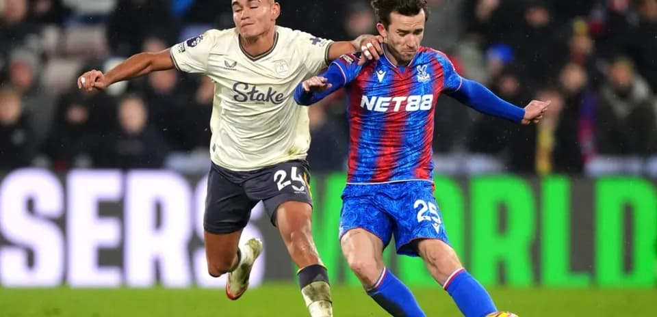 Crystal Palace player tackling Everton opponent