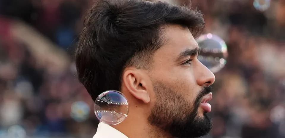 Player with bubbles near ear during match