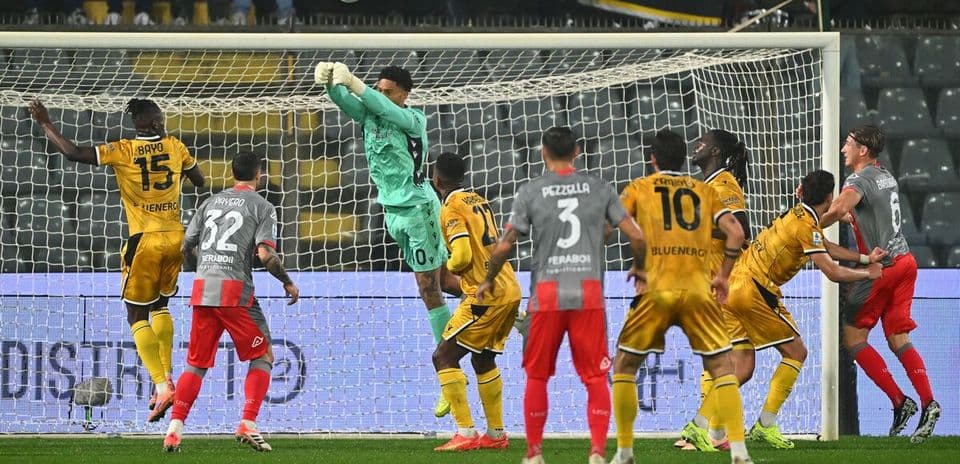 Goalkeeper catching the ball during Udinese match