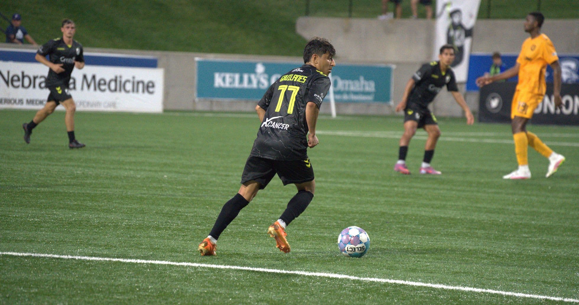 Player dribbling the ball during USL match