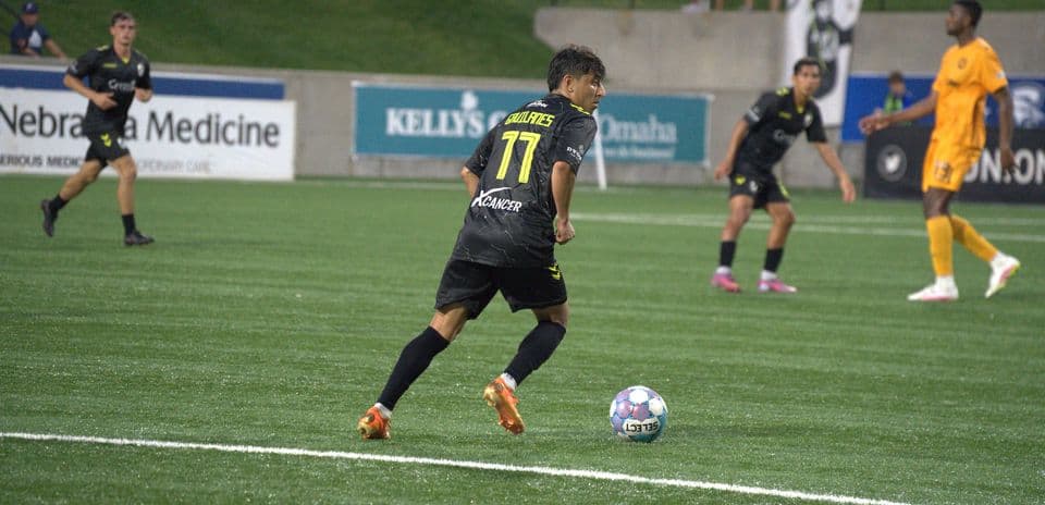 Player dribbling the ball during USL match