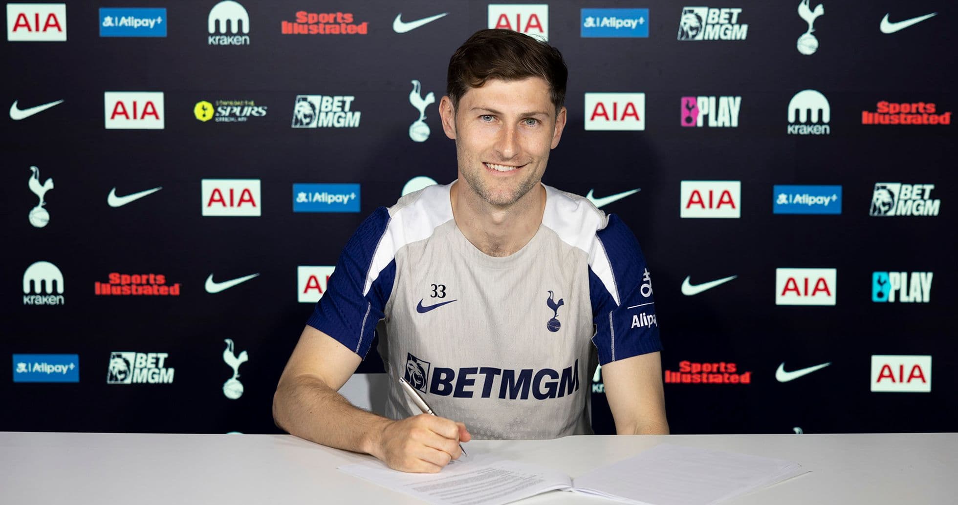 Player signing contract at Tottenham Hotspur press event
