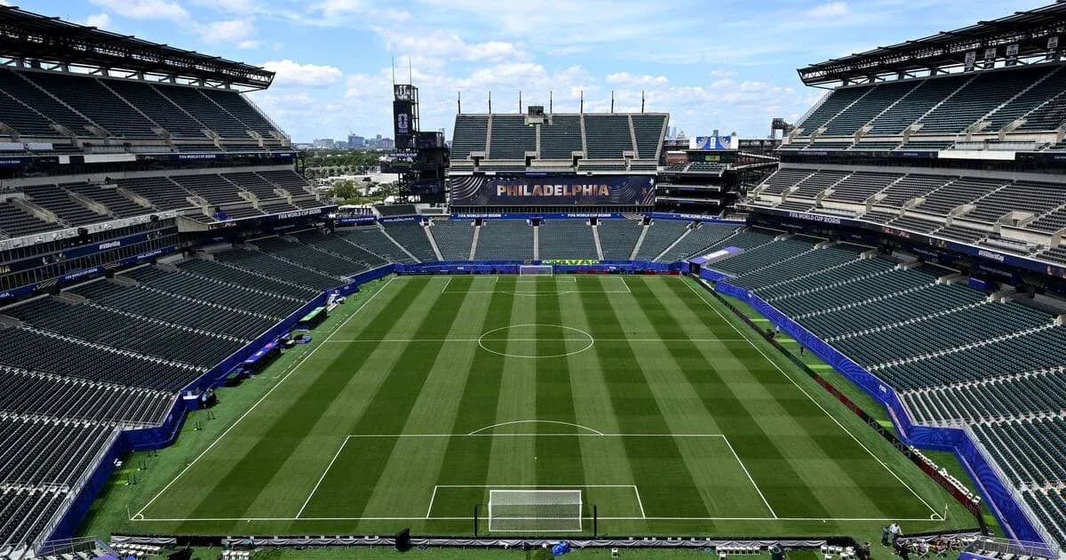 Empty soccer stadium with well-maintained pitch