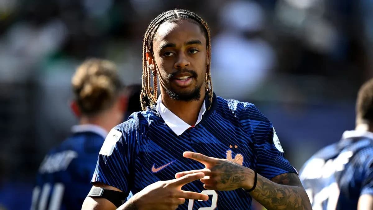 Player in France jersey making hand gesture