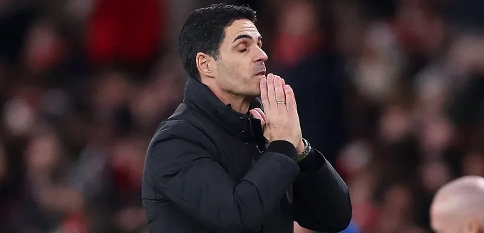 Coach gesturing during a football match