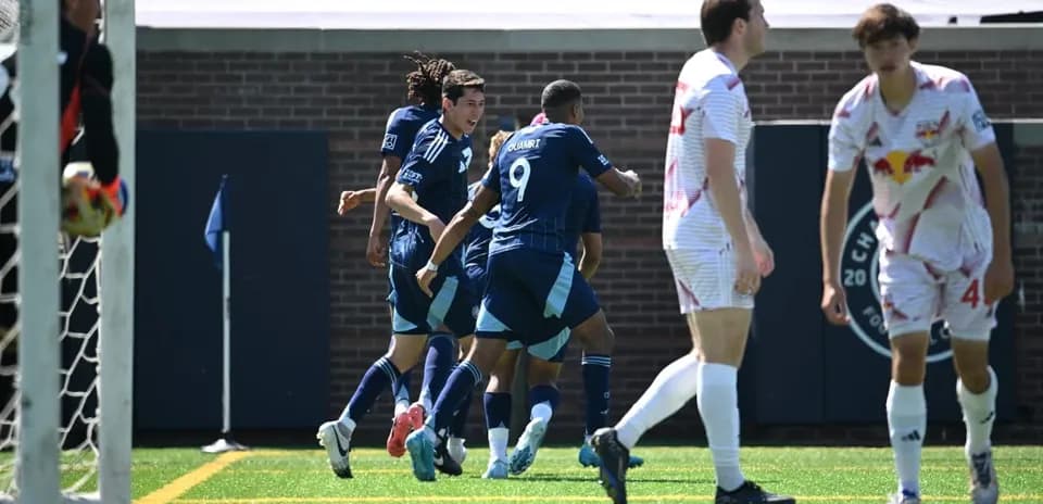 Players celebrating a goal during match