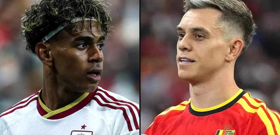 Two football players from Spain and Belgium in action
