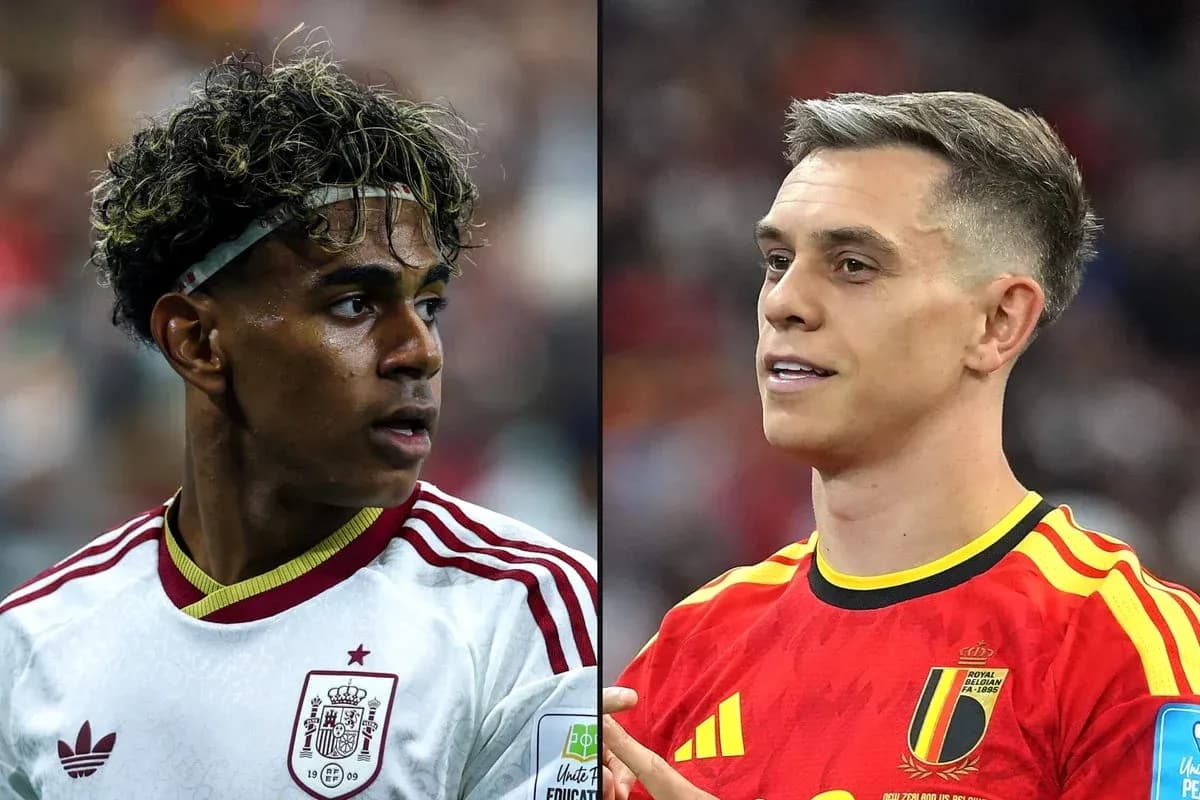 Two football players from Spain and Belgium in action