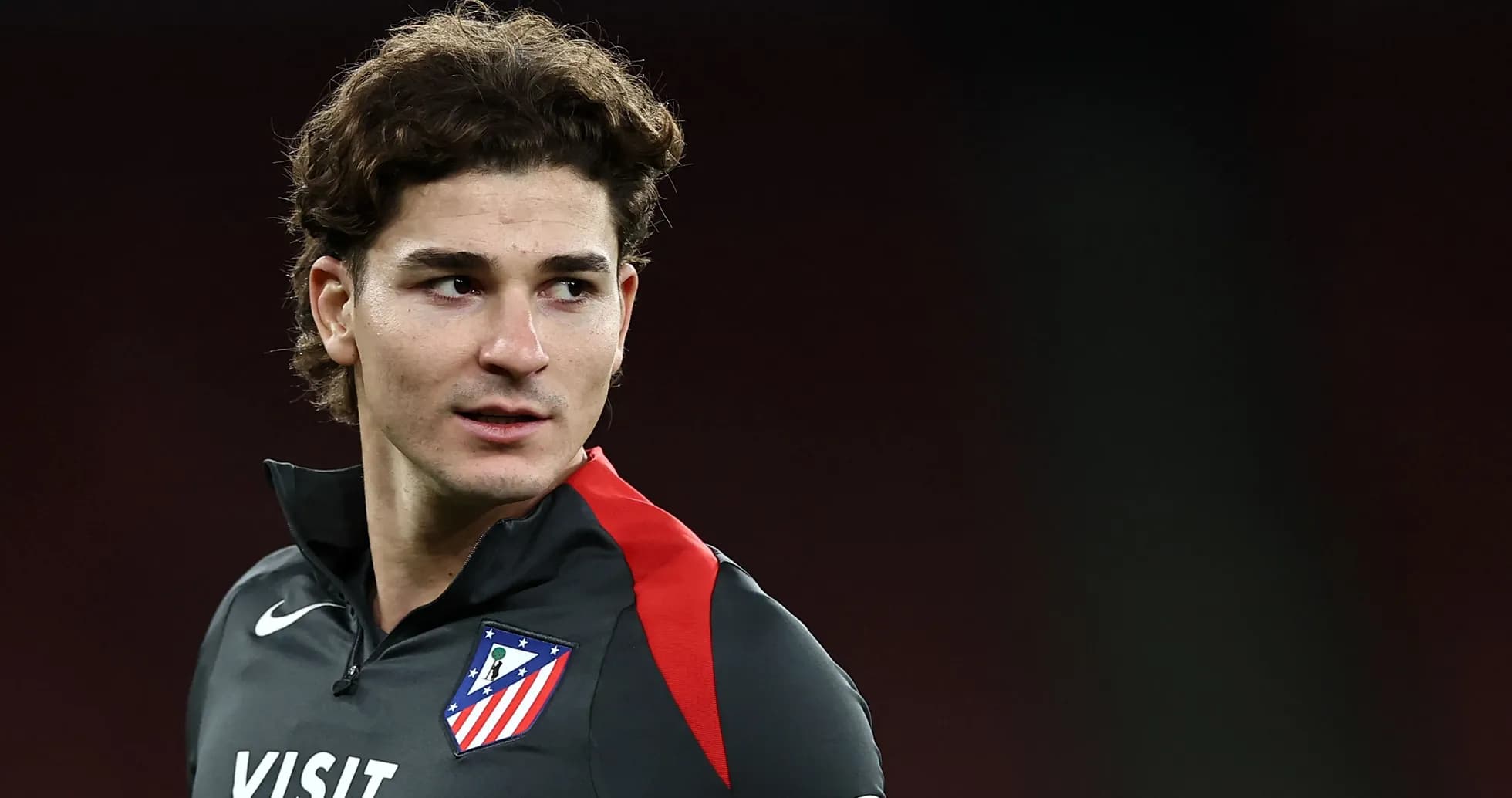 Athletic player in training gear with club logo