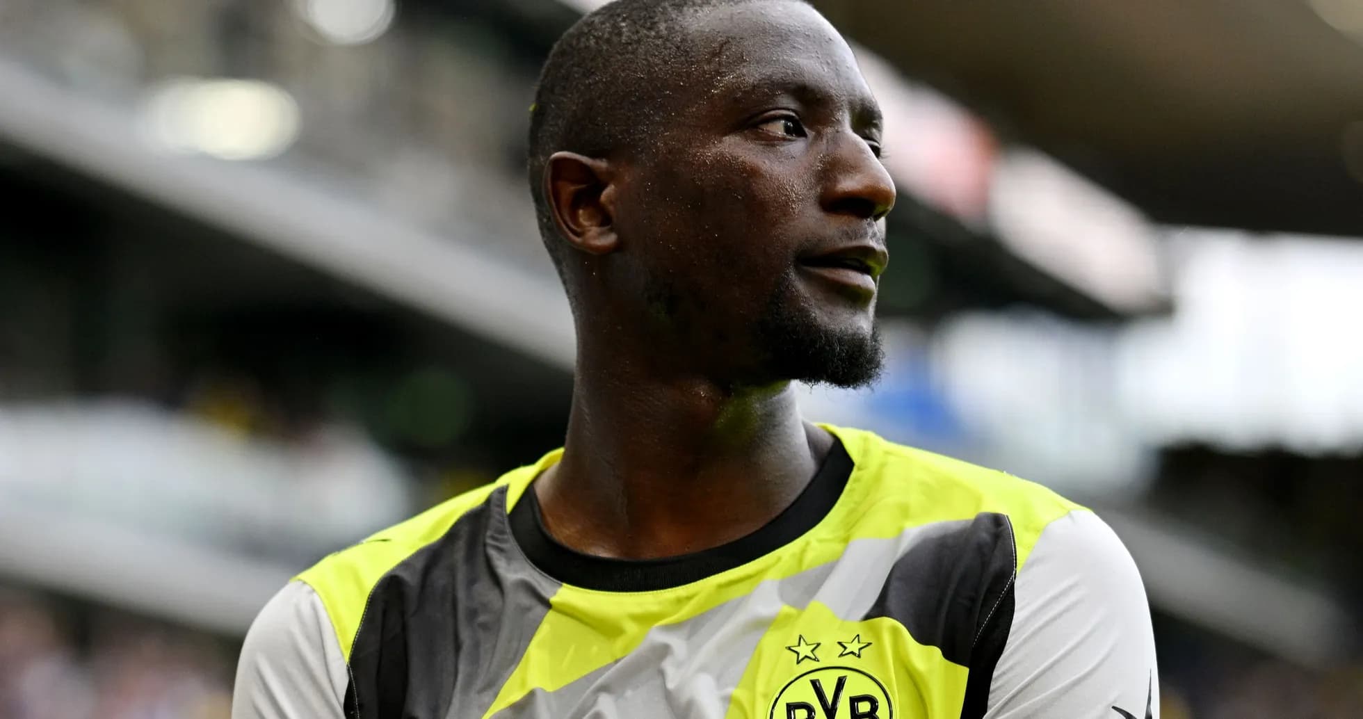 Player in Borussia Dortmund training kit on field