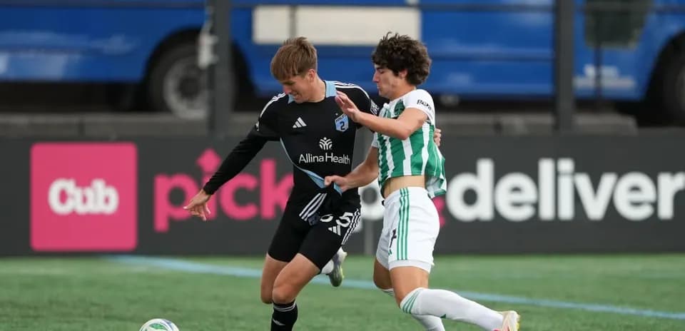 Players competing for the ball in MLS Next Pro