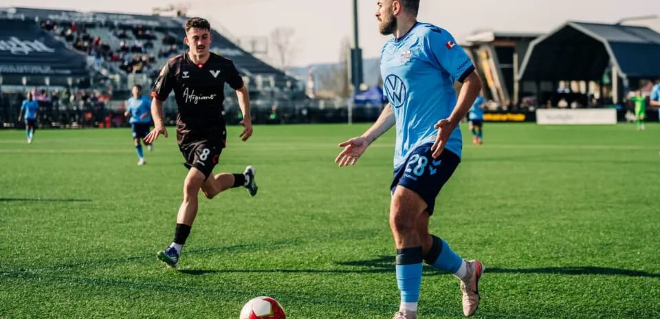 HFX Wanderers FC player dribbling the ball