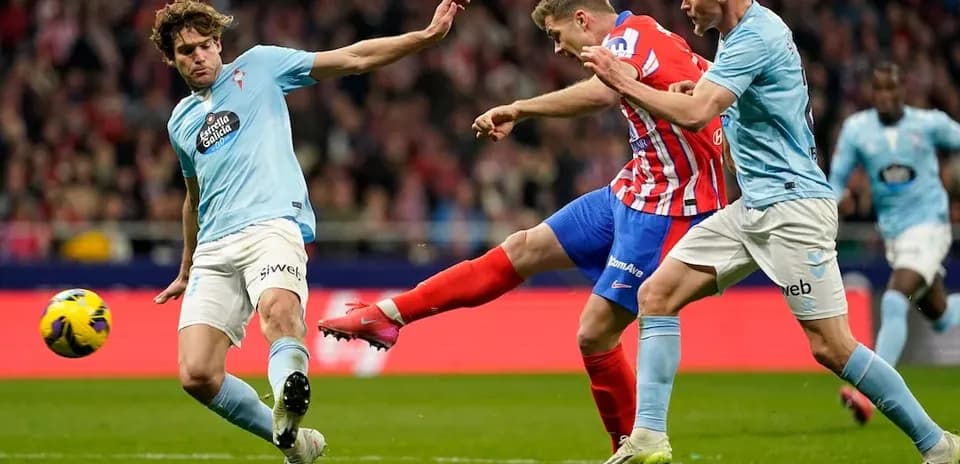Atletico Madrid player shooting during match against Celta Vigo