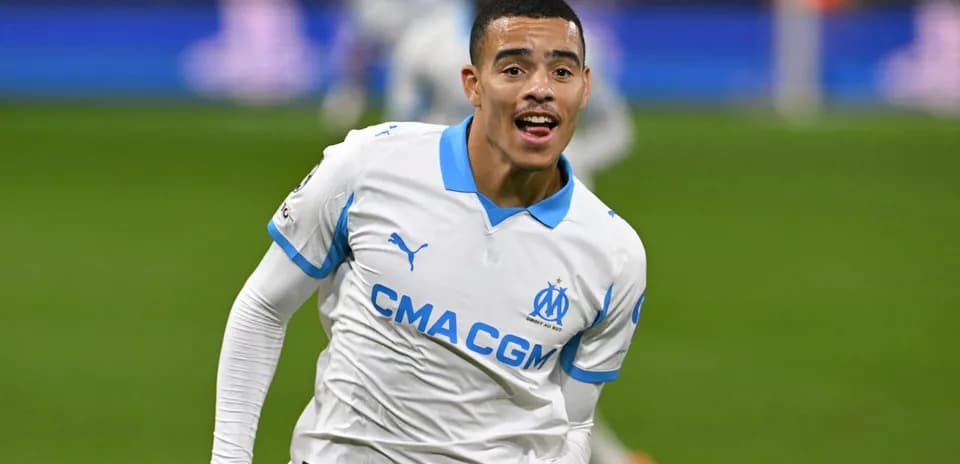 Player celebrating a goal wearing Marseille jersey