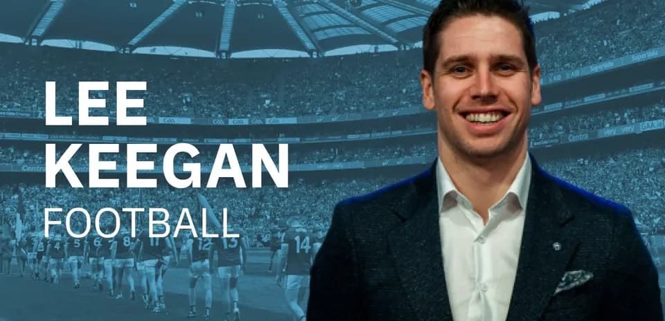 Lee Keegan smiling in front of football stadium