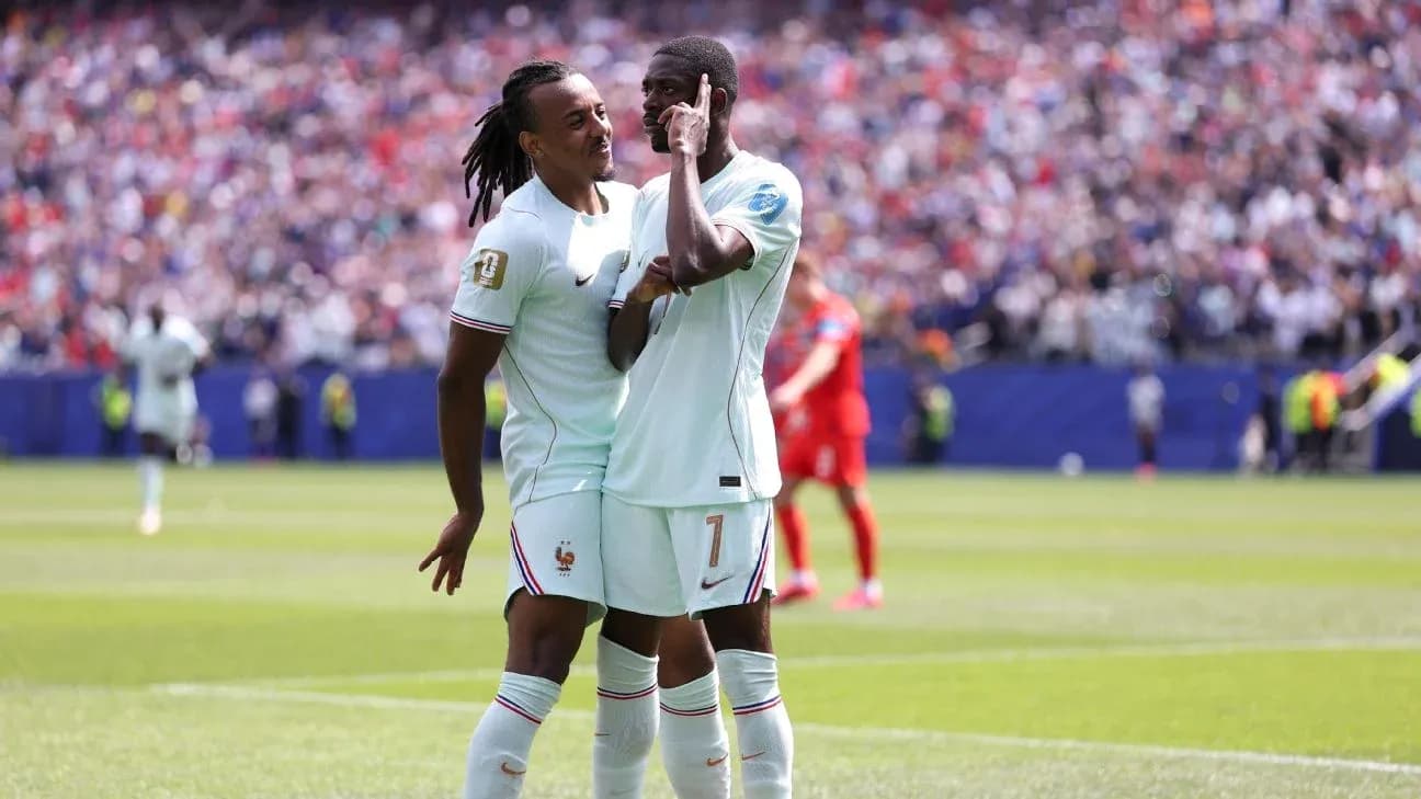 Two France players celebrating on the field