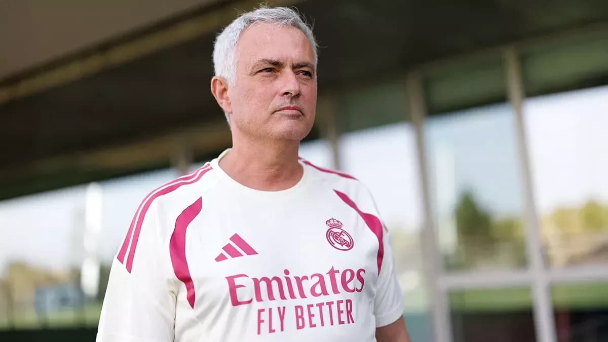 Coach wearing Real Madrid training kit outdoors