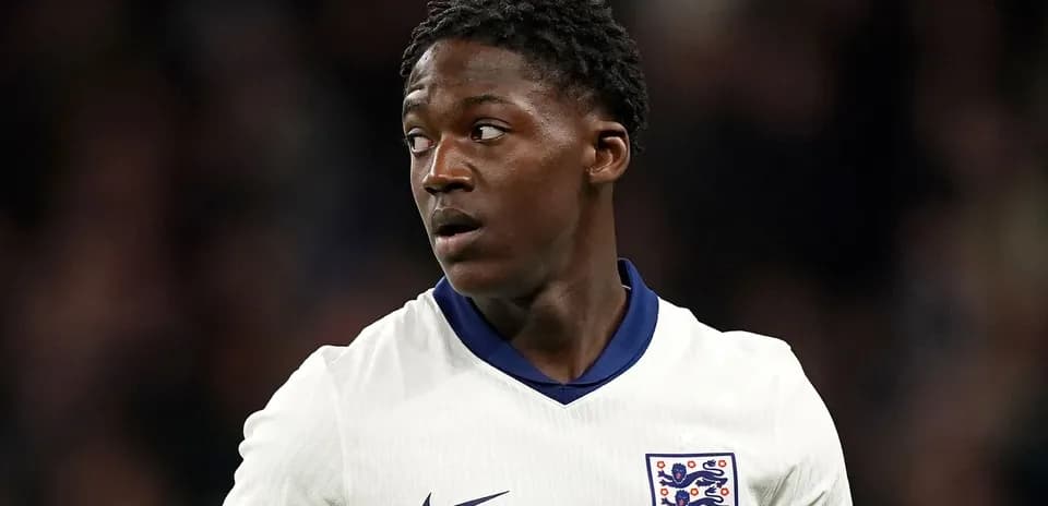 Football player wearing England kit during match