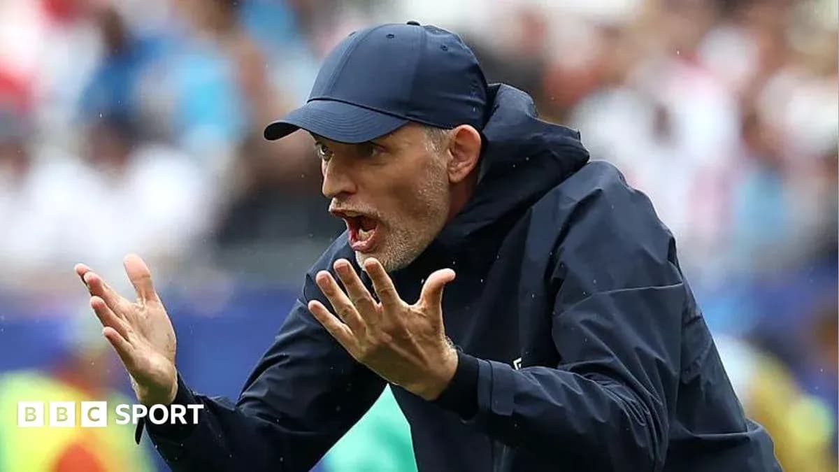 Coach gesturing during a match on the sidelines