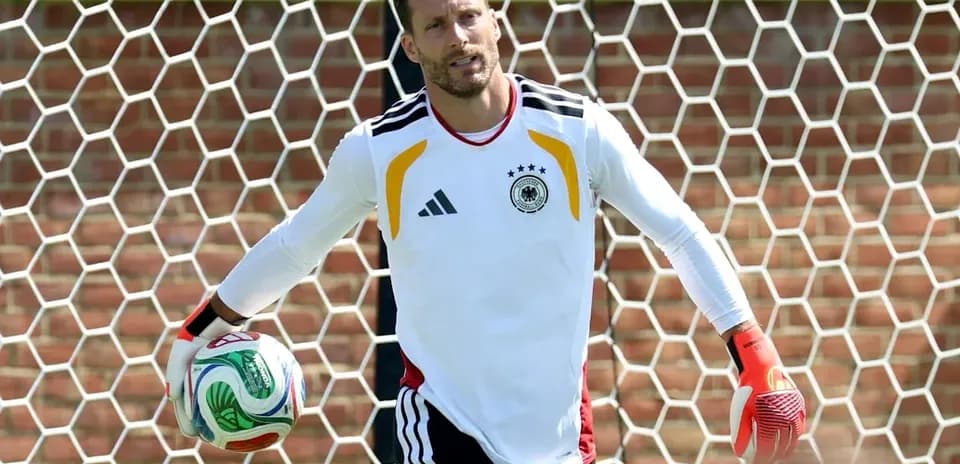 Goalkeeper holding a soccer ball in training