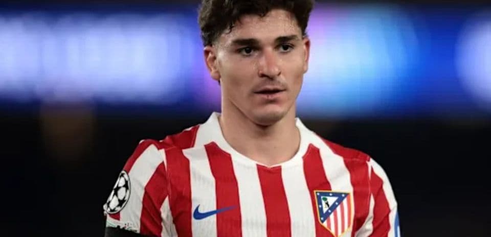 Player wearing Atlético Madrid jersey on the field