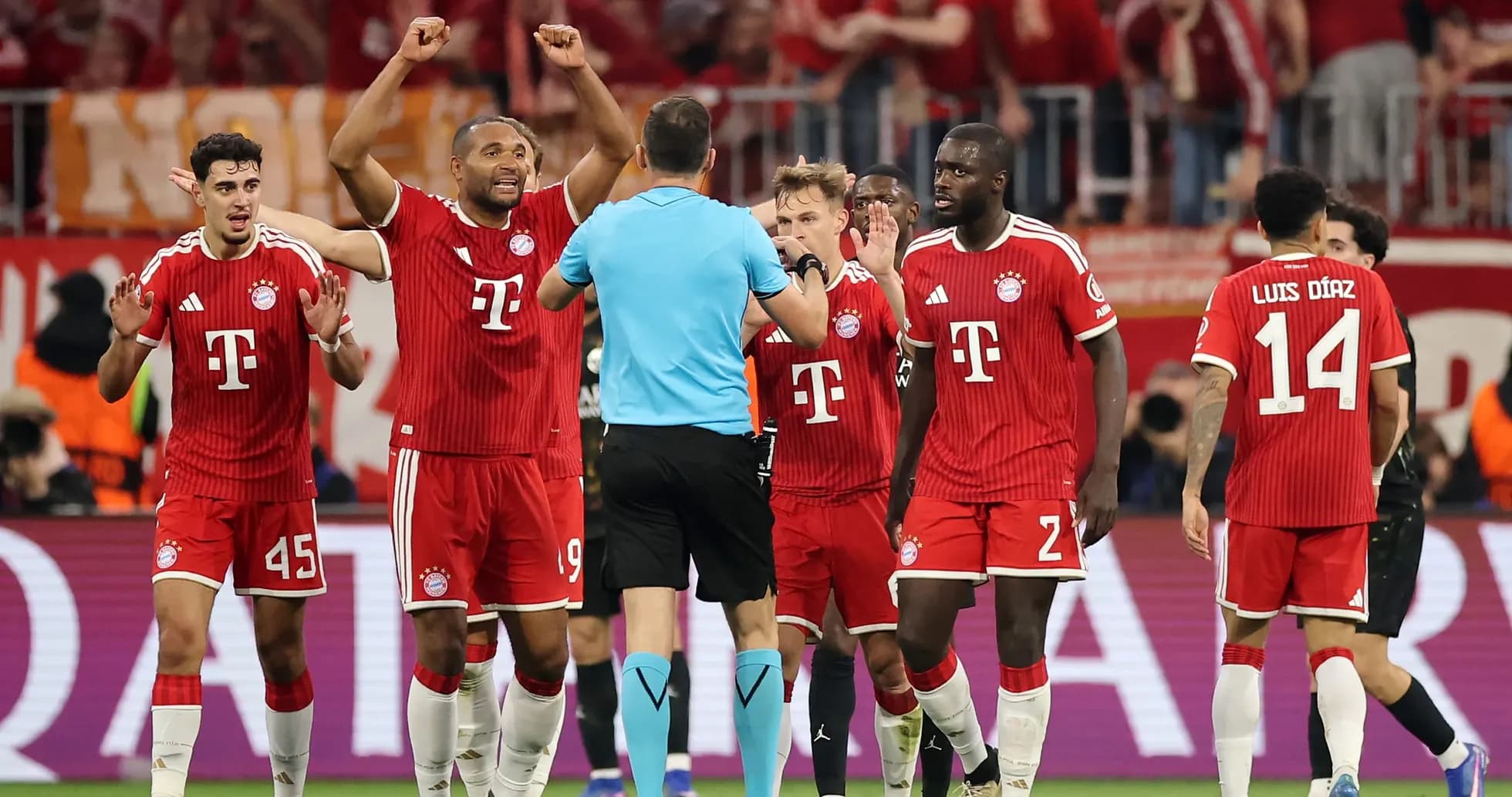 Bayern players arguing with the referee during match