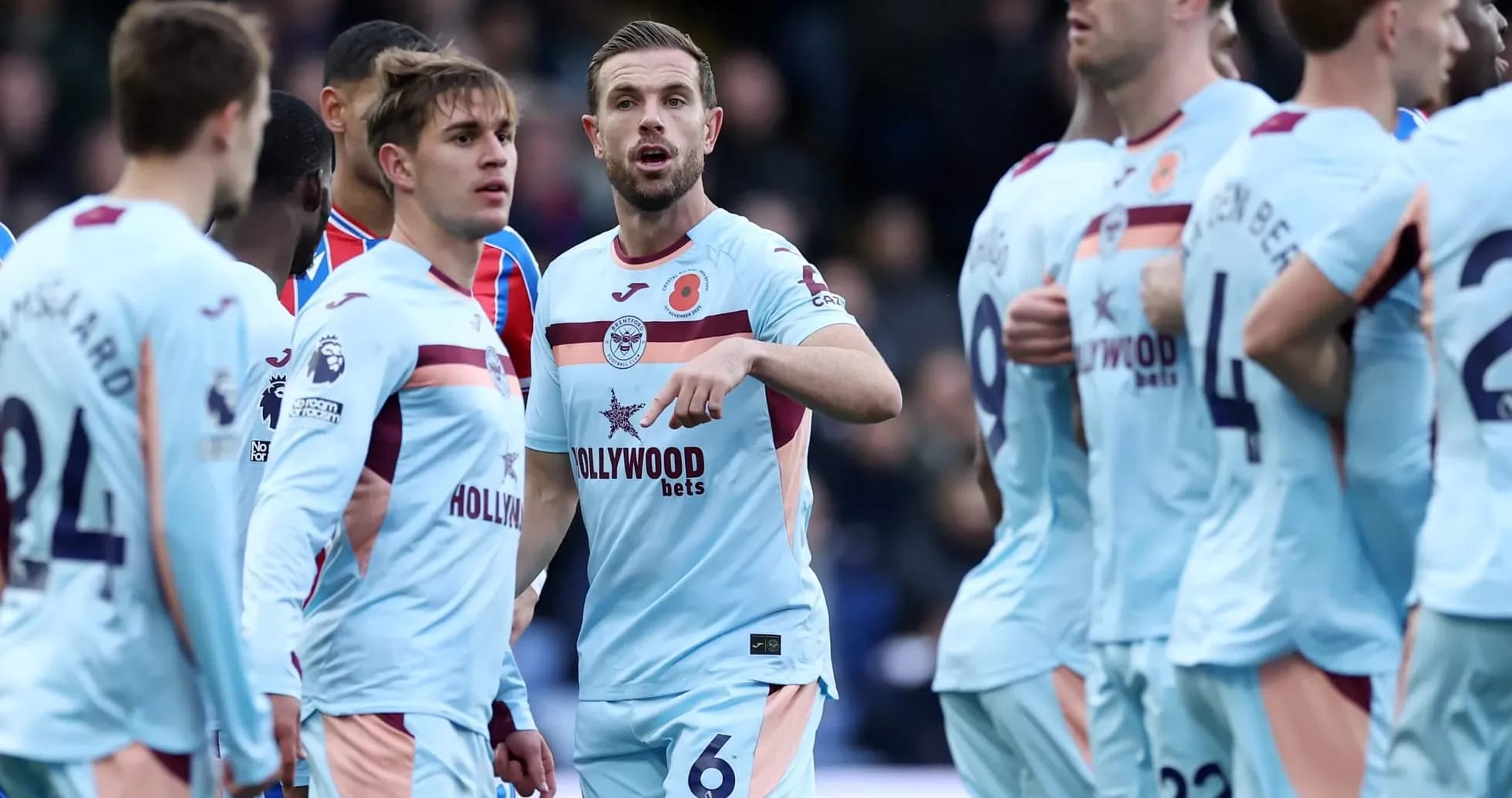 Brentford players discussing during Premier League match