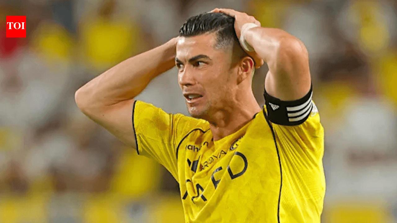 Player in yellow jersey showing frustration on field