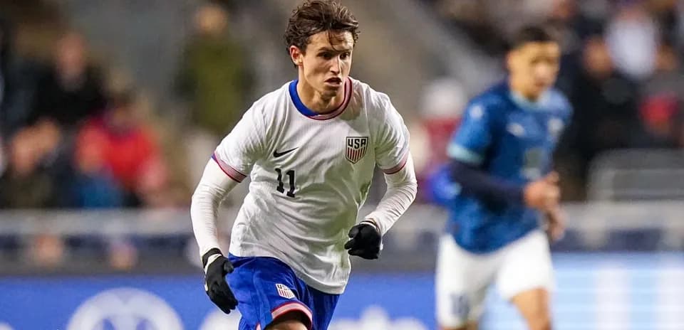 US player dribbling the ball during match