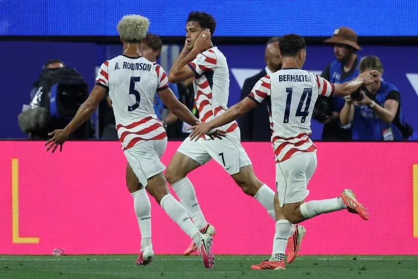 US players celebrating a goal during match