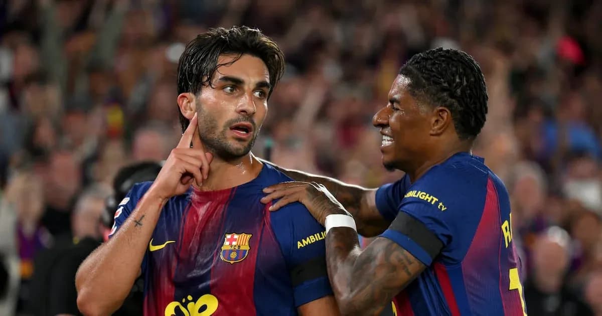 Two FC Barcelona players celebrating after a goal