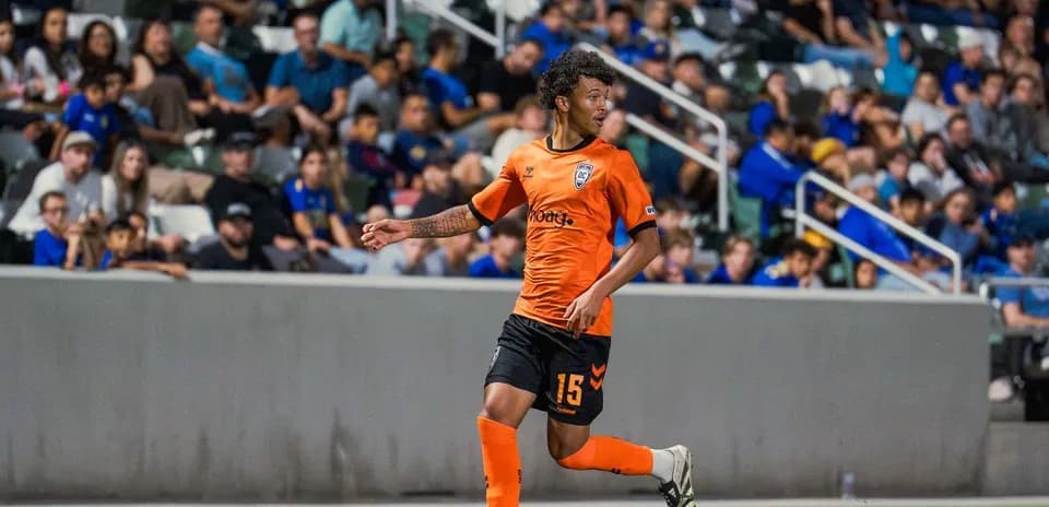 Orange County SC player dribbling the ball