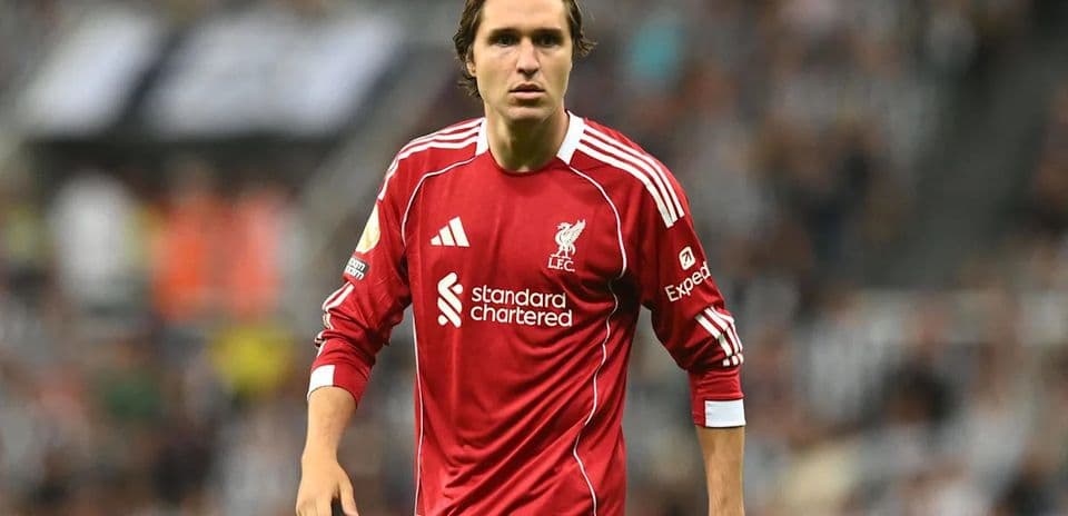 Player wearing Liverpool jersey during match action