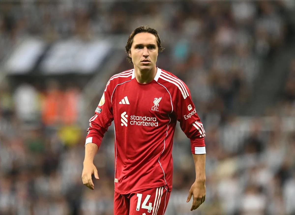 Player wearing Liverpool jersey during match action