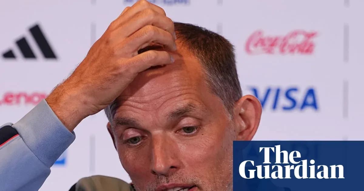 Manager speaking during press conference with hand on head