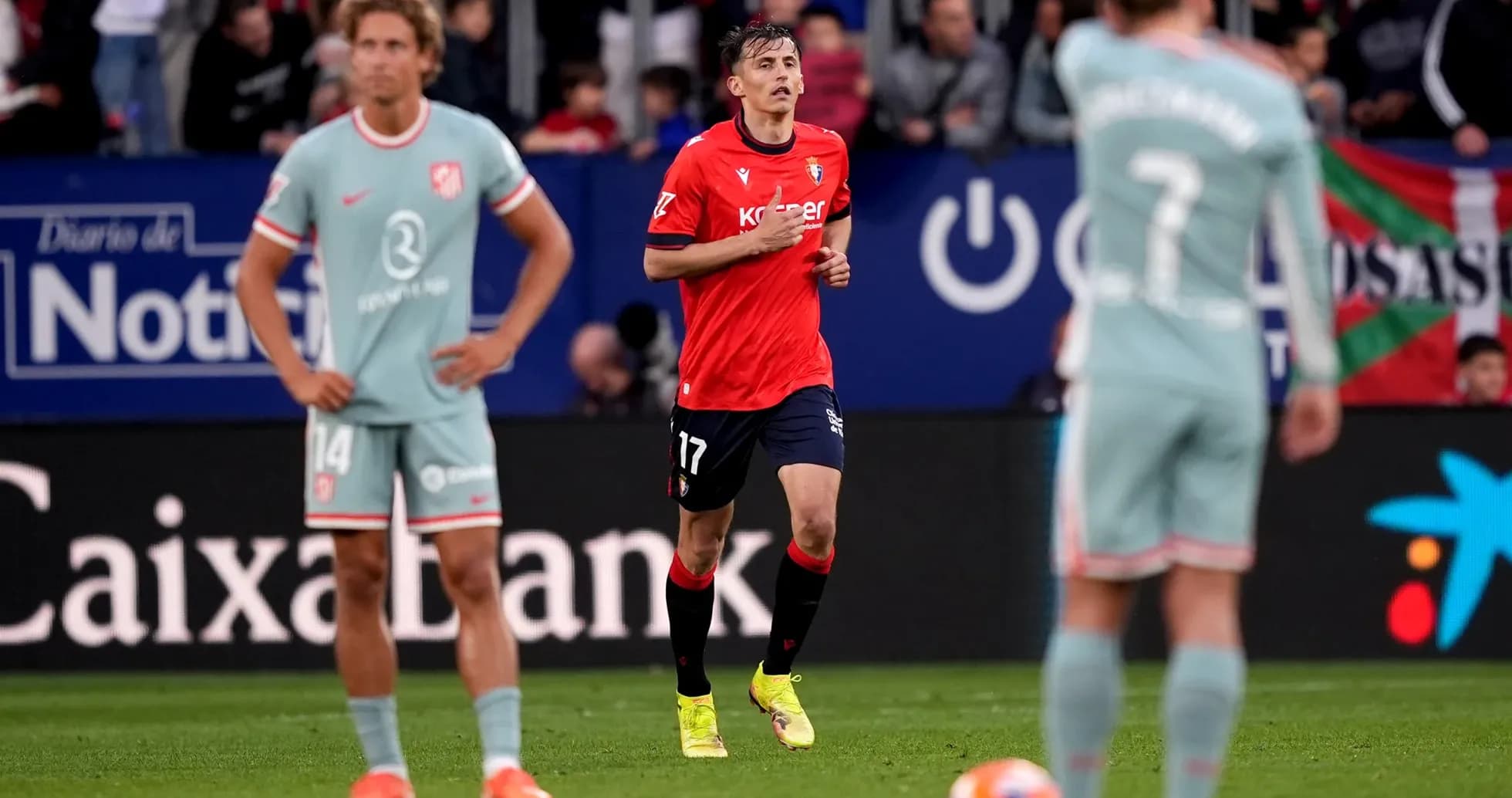 Osasuna player running during match against Atletico Madrid