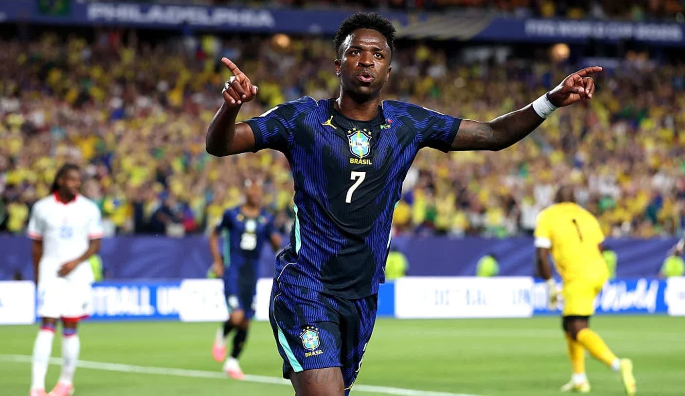 Player celebrating goal with fans in background