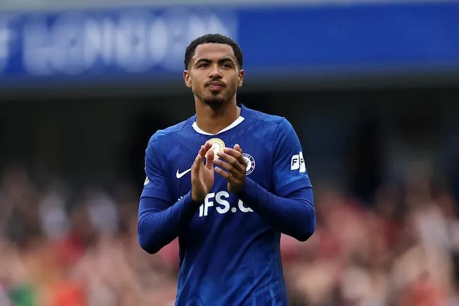 Player applauding fans in blue team jersey