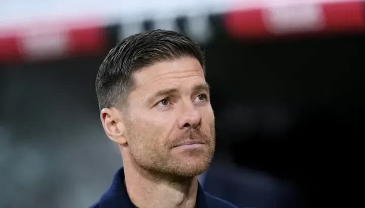 Coach observing match from sidelines